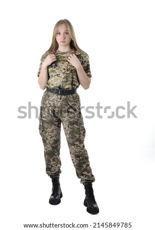 Full length portrait of a young beautiful female military doctor in a camouflage uniform  with stethoscope around her neck looking at camera isolated on a white background