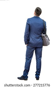 Full Length Portrait Of Young Businessman Standing In Blue Suit. Young Man Giving Back To Camera Showing Rear View.Isolated On White Background.