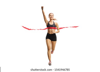 Full Length Portrait Of A Young Female Runner On The Finish Line Of A Marathon Gesturing Happiness Isolated On White Background