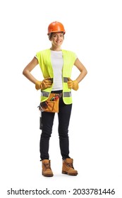 Full Length Portrait Of A Young Female Construction Worker Wearing A Hardhat And A Tool Belt Isolated On White Background