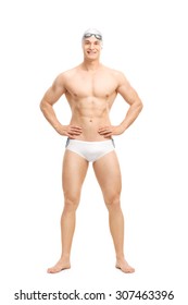 Full Length Portrait Of A Young Handsome Swimmer Posing In White Swim Trunks Isolated On White Background