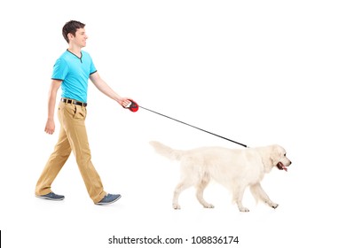 Full Length Portrait Of A Young Man Walking A Dog, Isolated On White Background