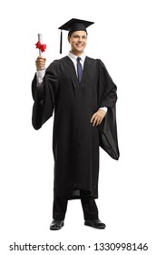 Full Length Portrait Of A Young Man In A Black Graduation Gown And Cap Holding A Diploma Isolated On White Background