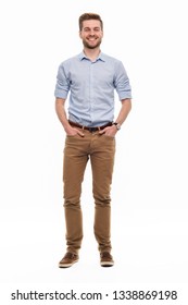 Full Length Portrait Of Young Man Standing On White Background