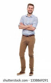 Full length portrait of young man standing on white background - Shutterstock ID 1338869291