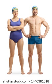 Full length portrait of a young man and woman in swimming suits, googles and a cap isolated on white background