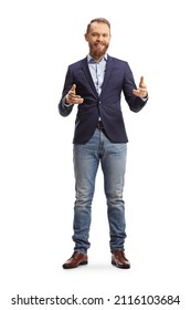 Full length portrait of a young man in suit and jeans smiling and explaining with hands isolated on white background - Shutterstock ID 2116103684