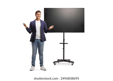 Full length portrait of a young man presenting in front of tv screen on a stand isolated on white background - Powered by Shutterstock