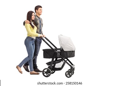 Full Length Portrait Of A Young Parents Pushing A Baby Stroller Isolated On White Background