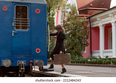 Full Length Portrait Of Young Vintage Lady In Old Vintage Train Station. Photo In Retro Style