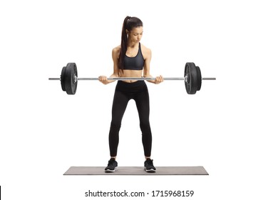 Full Length Portrait Of A Young Woman In Sportswear Lifting Weights Isolated On White Background