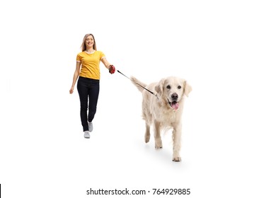 Full Length Portrait Of A Young Woman Walking A Dog Isolated On White Background