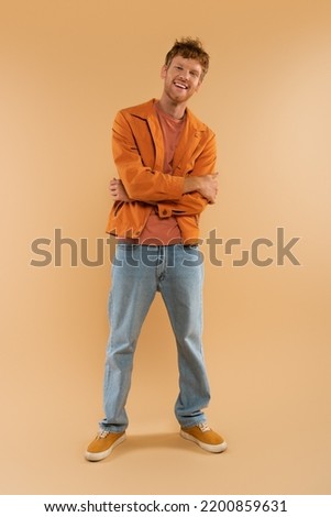 Similar – Image, Stock Photo Man in Orange Jacket Enjoying Misty Iceland Landscape