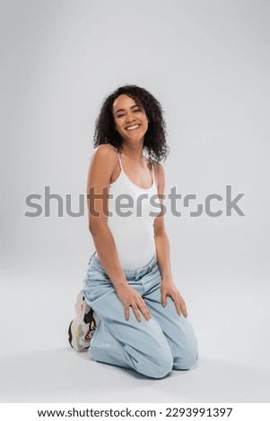 Similar – Brunette surfer woman with top holding surfboard