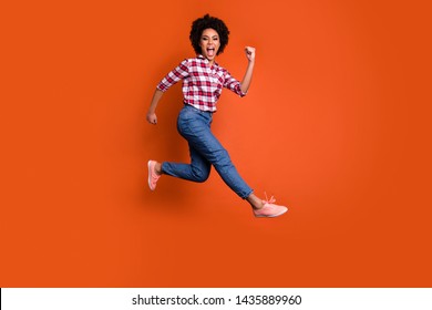 Full length profile photo of jumping high model lady yelling sale discount wear casual pants shirt clothes outfit isolated orange background