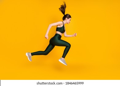 Full Length Profile Photo Of Sportive Lady Jump High Up Running Wear Sports Suit Shoes Isolated Yellow Color Background