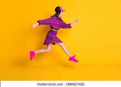 Full Length Profile Portrait Of Attractive Lady Running Headwear Magenta Outfit Isolated On Yellow Color Background