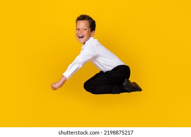 Full Length Profile Portrait Of Crazy Overjoyed Person Falling Have Fun Isolated On Yellow Color Background