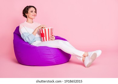 Full Length Profile Portrait Of Pretty Person Sitting Big Soft Chair Look Empty Space Isolated On Pink Color Background