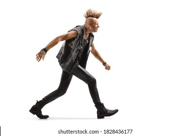 Full length profile shot of an angry punk man with a mohawk running isolated on white background