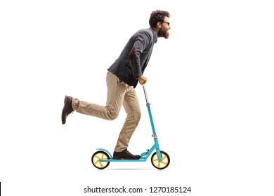 Full Length Profile Shot Of A Bearded Man Riding A Scooter Isolated On White Background