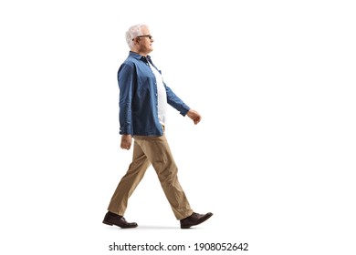 Full Length Profile Shot Of A Casual Mature Man Walking Isolated On White Background