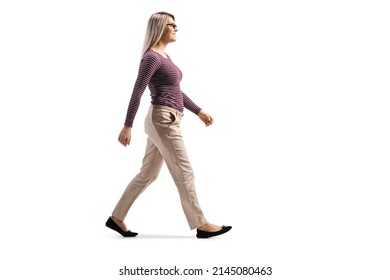 Full Length Profile Shot Of A Casual Blond Young Woman With Glasses Walking Isolated On White Background