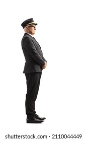 Full Length Profile Shot Of A Chauffeur Standing And Waiting Isolated On White Background