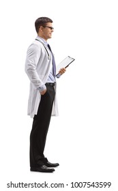 Full Length Profile Shot Of A Doctor With A Clipboard Waiting In Line Isolated On White Background