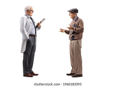 Full length profile shot of a doctor talking with an elderly man patient isolated on white background - Powered by Shutterstock