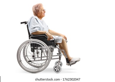 Full Length Profile Shot Of An Elderly Female Patient Sitting In A Wheelchair Isolated On White Background