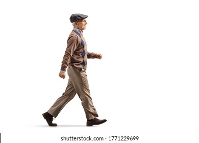 Full Length Profile Shot Of An Elderly Man Walking Fast Isolated On White Background