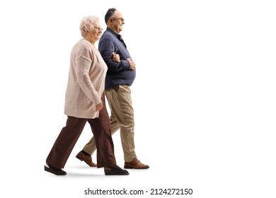 Full length profile shot of an elderly woman walking with a man isolated on white background - Powered by Shutterstock