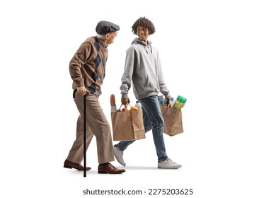 Full length profile shot of an elderly man walking with a cane and african american guy carrying his grocery bags isolated on white background - Powered by Shutterstock