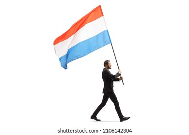 Full Length Profile Shot Of An Elegant Man In A Suit Walking And Carrying A Dutch Flag Isolated On White Background