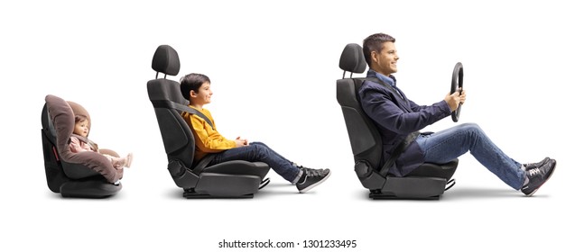 Full Length Profile Shot Of A Father In A Car Seat Holding A Steering Wheel With Son And Baby Behind In Car Seats Isolated On White Background