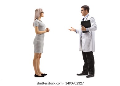 Full Length Profile Shot Of A Female Patient And A Doctor Talking Isolated On White Background