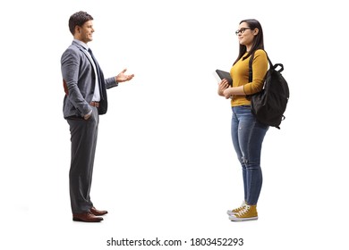 Full Length Profile Shot Of A Female Student And A Man Standing And Talking Isolated On White Background