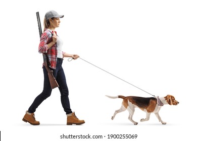 Full Length Profile Shot Of A Female With A Rifle Walking A Beagle Dog On A Lead Isolated On White Background