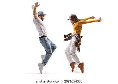 Full Length Profile Shot Of A Female And Male Dancer In Casual Clothes Dancing On Tiptoes Isolated On White Background