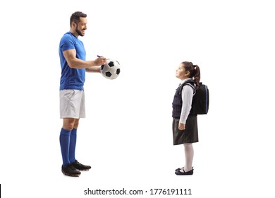 Full Length Profile Shot Of A Footballer Giving An Autograph On A Soccer Ball To A Schoolgirl Isolated On White Background