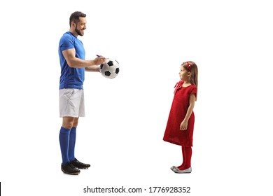 Full Length Profile Shot Of A Footballer Signing An Autograph On A Soccer Ball For A Little Girl Fan Isolated On White Background