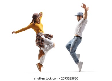 Full length profile shot of a guy and girl dancing hip hop isolated on white background