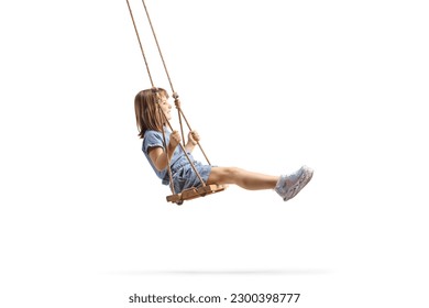 Full length profile shot of a happy little girl swinging on a wooden swing isolated on white background