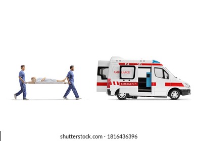 Full length profile shot of healthcare workers carrying a stretcher with a patient into an ambulance vehicle isolated on white background