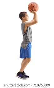 Full Length Profile Shot Of A Kid Throwing A Basketball Isolated On White Background