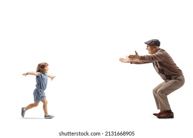 Full length profile shot of a little girl running towards an elderly man with open arms isolated on white background - Shutterstock ID 2131668905