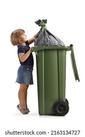 Full Length Profile Shot Of A Little Girl Putting A Waste Bag In A Plastic Bin Isolated On White Background