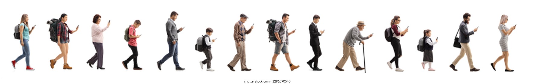 Full Length Profile Shot Of A Long Queue Of People Walking And Using A Mobile Phone Isolated On White Background