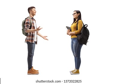 Full Length Profile Shot Of Male And Female Students Talking Isolated On White Background